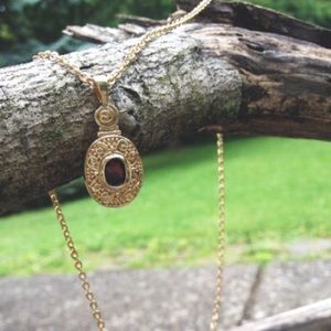 stone pendant on gold chain